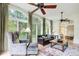 Bright living room featuring large windows, ceiling fans, and an open concept layout at 42 Greenland Trce, Atlanta, GA 30342