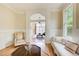 Spacious living area with hardwood floors and an archway that opens to another living area at 42 Greenland Trce, Atlanta, GA 30342