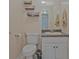Cozy bathroom features updated vanity, sink, and toilet at 4296 Linda Sw Ln, Lilburn, GA 30047