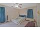 Bedroom features a bed, bench, and curtains at 4296 Linda Sw Ln, Lilburn, GA 30047