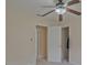 Neutral bedroom with a ceiling fan and doorway leading to other rooms at 4296 Linda Sw Ln, Lilburn, GA 30047