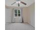 Bright bedroom featuring a ceiling fan and a window with natural light at 4296 Linda Sw Ln, Lilburn, GA 30047