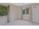 Bedroom with two windows dressed with curtains and a white door at 4296 Linda Sw Ln, Lilburn, GA 30047