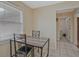 Cozy breakfast nook with a small table and chairs, next to a window at 4296 Linda Sw Ln, Lilburn, GA 30047