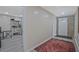 Entryway features brick accent wall and access to unfinished storage area at 4296 Linda Sw Ln, Lilburn, GA 30047