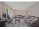 Spacious living room with plush seating, a large window, and a comfortable work-from-home area at 4296 Linda Sw Ln, Lilburn, GA 30047