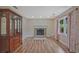 Living room boasts fireplace, hardwood floors, recessed lighting and large window at 4296 Linda Sw Ln, Lilburn, GA 30047