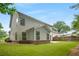 Exterior shot of the backyard with green grass, patio, and privacy fence at 830 Nottingham Se Dr, Smyrna, GA 30082