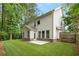 A spacious yard with a patio for outdoor activities at 830 Nottingham Se Dr, Smyrna, GA 30082