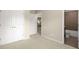 Bedroom with neutral carpeting, showing access to closet and attached bath at 830 Nottingham Se Dr, Smyrna, GA 30082