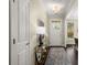 Inviting foyer with hardwood floors, elegant lighting, and a view to the dining room at 830 Nottingham Se Dr, Smyrna, GA 30082