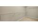 Walk-in closet with wire shelving and neutral carpeting; providing ample storage space at 830 Nottingham Se Dr, Smyrna, GA 30082