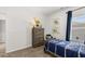 bedroom features a comfy single bed, dinosaur decorations and a dresser for storage at 1095 Elowen Dr, Austell, GA 30168