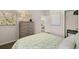 Bright bedroom with a plush bed, dresser, and a walk-in closet for ample storage at 1095 Elowen Dr, Austell, GA 30168