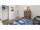 Comfortable bedroom features a single bed with dinosaur decorations and ample closet space at 1095 Elowen Dr, Austell, GA 30168