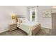 Inviting bedroom features a comfortable bed, a nightstand, and bright natural light at 1095 Elowen Dr, Austell, GA 30168