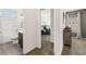 Hallway view shows the bathroom with shower, a bedroom, and carpet flooring at 1095 Elowen Dr, Austell, GA 30168