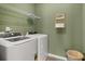 Efficient laundry room with modern appliances, storage shelves, and a practical design at 1095 Elowen Dr, Austell, GA 30168