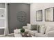 Comfortable living room featuring gray accent wall, luxury seating, and natural light at 1095 Elowen Dr, Austell, GA 30168