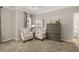 Inviting sitting area with plush chairs and neutral decor in a bright, carpeted main bedroom at 1095 Elowen Dr, Austell, GA 30168