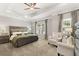 Spacious main bedroom featuring a tray ceiling, neutral walls, plush carpet and sitting area at 1095 Elowen Dr, Austell, GA 30168