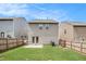 Spacious backyard with a wooden fence, patio, and lush green lawn at 5152 Rapahoe Trl, Atlanta, GA 30349