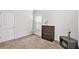 Cozy bedroom with plush carpeting, window, and ample natural light at 5152 Rapahoe Trl, Atlanta, GA 30349