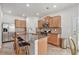 Well-equipped kitchen featuring stainless steel appliances, granite countertops, and a breakfast bar with seating at 5152 Rapahoe Trl, Atlanta, GA 30349