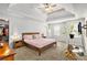 Spacious main bedroom features plush carpeting, a tray ceiling, and plenty of natural light for a serene retreat at 5152 Rapahoe Trl, Atlanta, GA 30349