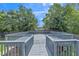 Large, wooden back deck overlooking lush greenery at 7262 Sandpiper Way, Riverdale, GA 30274