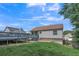 Exterior view of the backyard with a deck, grass, and privacy fence at 7262 Sandpiper Way, Riverdale, GA 30274