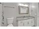 This bathroom includes a granite vanity and a shower with marble surround at 7262 Sandpiper Way, Riverdale, GA 30274