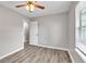This bedroom features hard surface floors, ceiling fan and window with blinds at 7262 Sandpiper Way, Riverdale, GA 30274