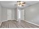 This bedroom features neutral walls, ceiling fan, and hard surface flooring at 7262 Sandpiper Way, Riverdale, GA 30274
