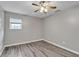The bedroom features hard surface flooring, ceiling fan and window with blinds at 7262 Sandpiper Way, Riverdale, GA 30274