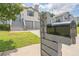 Charming two-story home features a well-manicured lawn, gray stairs and a two-car garage at 7262 Sandpiper Way, Riverdale, GA 30274