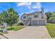 Charming two-story home with two-car garage and stairs, complemented by lush lawn and a mailbox at 7262 Sandpiper Way, Riverdale, GA 30274