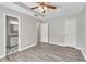 The spacious main bedroom boasts a ceiling fan and ensuite bathroom at 7262 Sandpiper Way, Riverdale, GA 30274
