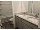 Bathroom including double sinks with granite countertops and a combined shower and bathtub at 1661 Fuma Leaf Way, Mcdonough, GA 30253