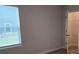 Sunlit bedroom features a window and a walk-in closet for ample storage at 1661 Fuma Leaf Way, Mcdonough, GA 30253