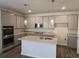New kitchen showcasing an island, gray cabinets, granite counters, and stainless steel appliances at 1661 Fuma Leaf Way, Mcdonough, GA 30253
