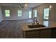 Modern kitchen view featuring stainless steel appliances and an open concept living space at 1661 Fuma Leaf Way, Mcdonough, GA 30253