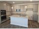This is a kitchen with stainless steel appliances, granite countertops, and an island with a sink at 1661 Fuma Leaf Way, Mcdonough, GA 30253