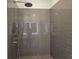 Walk-in shower with gray subway tile at 1661 Fuma Leaf Way, Mcdonough, GA 30253