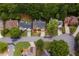 Aerial view of a neighborhood showcasing well-maintained homes with manicured lawns and tree-lined streets at 4960 Haydens Walk Dr, Johns Creek, GA 30022
