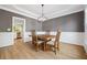 Cozy dining room featuring a wooden table set and decorative lighting at 4960 Haydens Walk Dr, Johns Creek, GA 30022