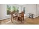 Inviting breakfast nook with hardwood floors and sunny windows, perfect for casual dining at 4960 Haydens Walk Dr, Johns Creek, GA 30022