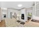 Bright kitchen features white cabinetry, stainless steel appliances, and granite countertops at 4960 Haydens Walk Dr, Johns Creek, GA 30022