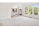 Bright living room with carpet floors and natural light from large windows at 4960 Haydens Walk Dr, Johns Creek, GA 30022