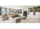 Basement living room provides plush seating, neutral carpet, and natural light from multiple windows at 4960 Haydens Walk Dr, Johns Creek, GA 30022